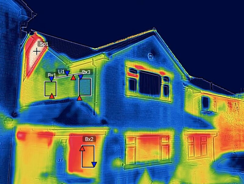Thermal image of a semi-detached house showing heat loss, with measurement markers overlaid