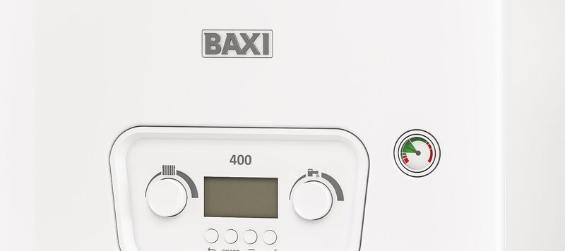 Close-up of the control panel of a white Baxi 400 combi boiler with dials, display and pressure gauge