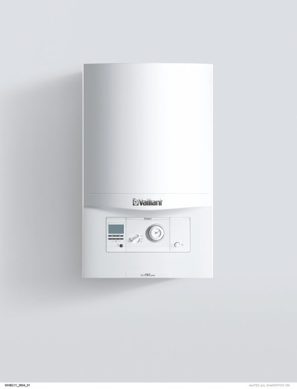 A white Vaillant ecoTEC pro wall-mounted gas boiler with control panel and dial on a plain grey background
