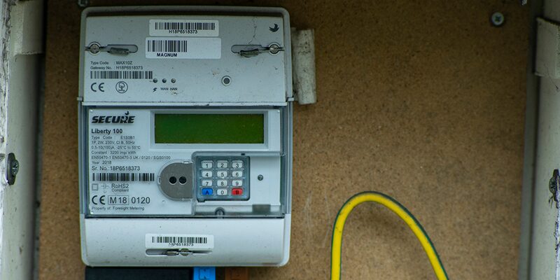 A Secure Liberty 100 prepayment smart electricity meter with keypad and display, mounted in a meter box