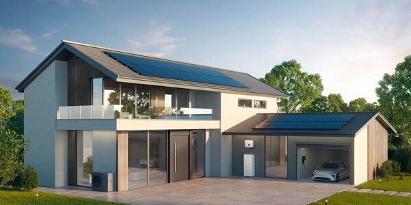 A modern house with rooftop solar panels, a heat pump, a home battery unit and an electric car charging in the garage