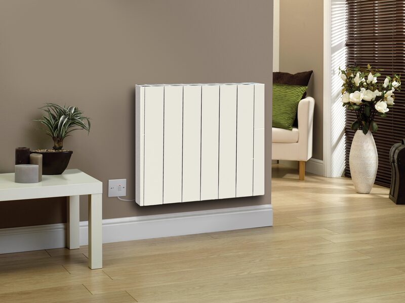 A white panel electric radiator mounted on a wall in a modern living room