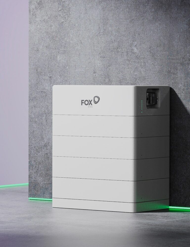 A white Fox ESS stacked home battery unit photographed against a concrete wall