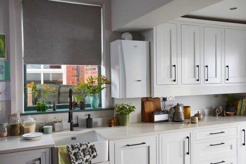 A white Ideal wall-mounted combi boiler installed in a bright kitchen above the worktop
