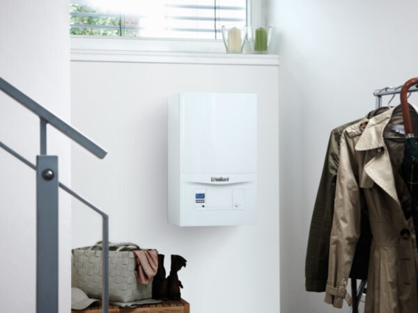 A white Vaillant ecoTEC pro wall-mounted gas boiler installed in a home hallway
