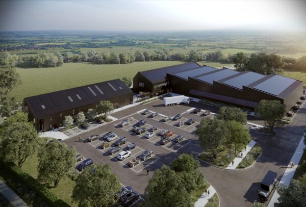 An aerial render of myenergi's large industrial headquarters building with solar panels on the roof, car park and surrounding countryside