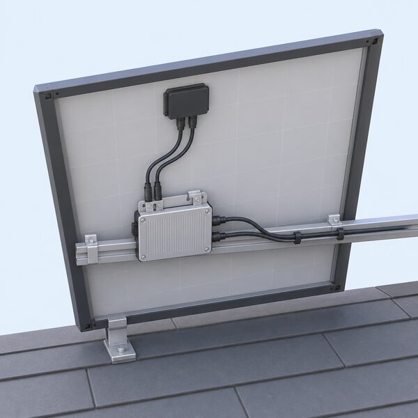 A single solar panel shown edge-on from behind, with a small rectangular microinverter mounted on its rear frame, its short cables running to the panel's junction box and along the mounting rail, drawn as a simple cutaway against a plain roof background.