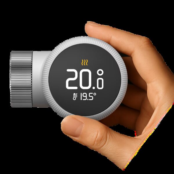 A hand holding a tado° Smart Radiator Thermostat X with LED display showing target 20.0° and room temperature 19.5°