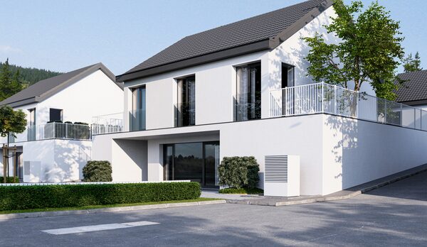 A modern white house with an air source heat pump unit installed on the exterior wall