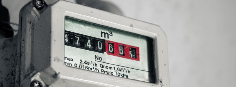 A close-up of a mechanical gas meter displaying a reading in cubic metres