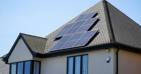 Solar panels installed on the tiled roof of a house