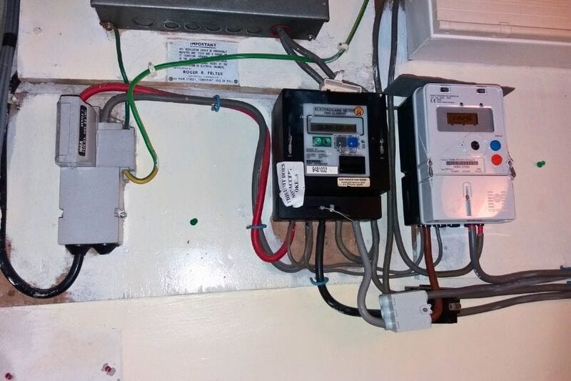 Electricity meters and wiring installed on a wall in a home
