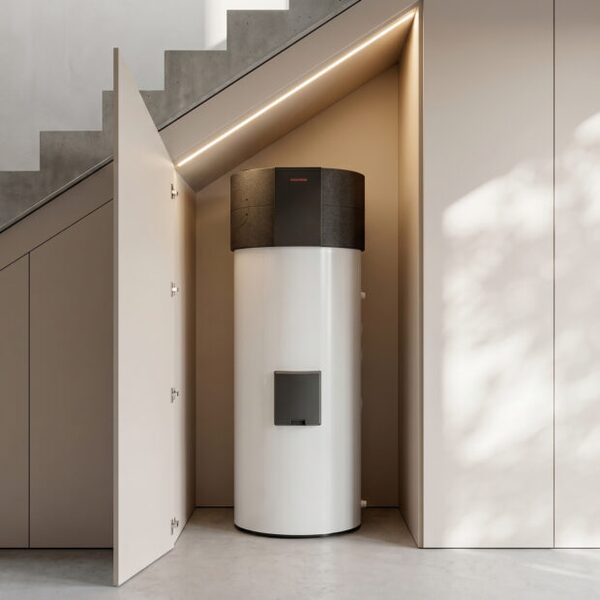A Kronoterm Essenta hot water heat pump cylinder installed in a cupboard under a staircase