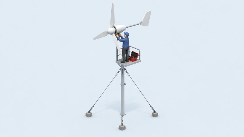 A technician in plain work clothing stands on a small platform at the top of a guyed mast, servicing a small domestic wind turbine, with an open toolbox beside them and the turbine's blades held still during the work.