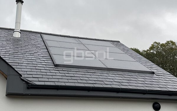 In-roof integrated solar panels flush with slate tiles on a house roof