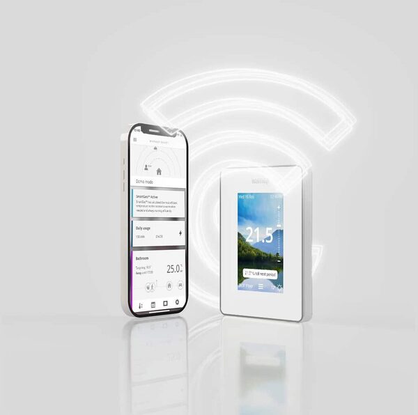 A Warmup smart WiFi thermostat for underfloor heating shown next to a smartphone running its control app, with a glowing WiFi symbol behind them