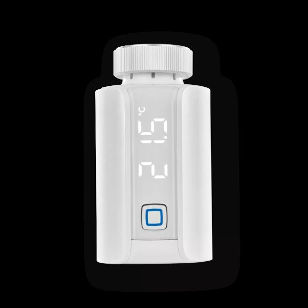 A white Homematic IP smart radiator thermostat with a digital display showing the temperature and a blue button