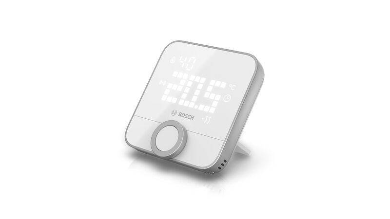 A white Bosch smart room thermostat with a digital display showing the temperature and a rotary dial, on a plain white background
