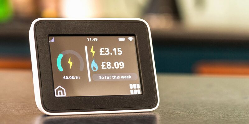 A smart meter display on a kitchen counter showing electricity and gas costs so far this week