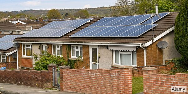 Bungalows with solar panels on their roofs in a residential street