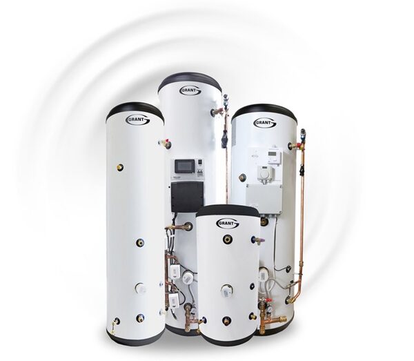 Four white Grant hot water cylinders of different sizes shown together with visible pipework and controls