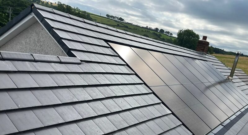 Marley solar tiles integrated into a slate-tiled roof of a rural UK house