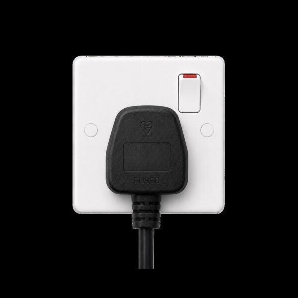 A black fused three-pin plug plugged into a white UK switched socket