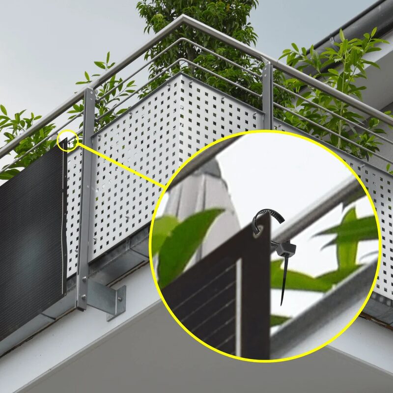 A balcony solar panel attached to a metal railing with a stainless steel cable tie, shown with a zoomed-in circular inset