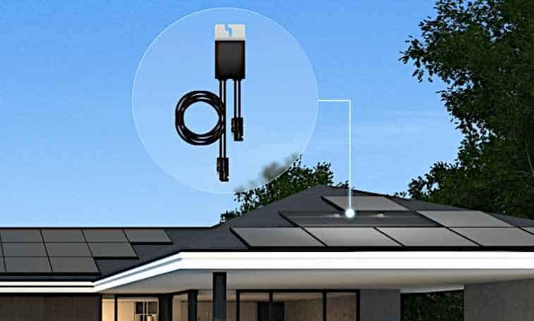 A solar panel optimiser device shown in a magnified circle above a house roof fitted with solar panels