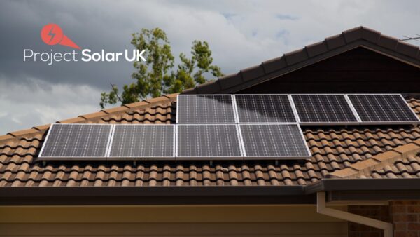 Solar panels installed on the tiled roof of a house, with a Project Solar UK logo overlaid