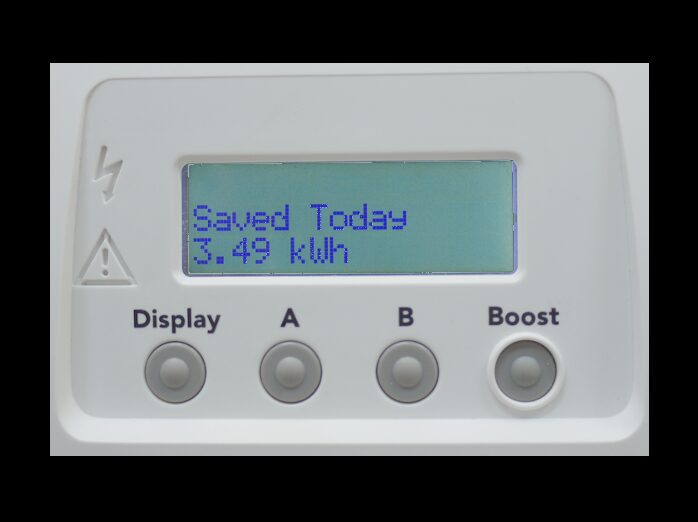 Close-up of a Solar iBoost+ solar water heating controller with an LCD showing 'Saved Today 3.49 kWh' and four buttons labelled Display, A, B and Boost
