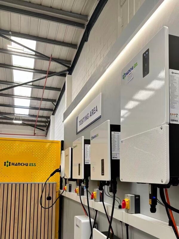 HANCHU ESS inverters mounted on a wall in a testing area of a service centre