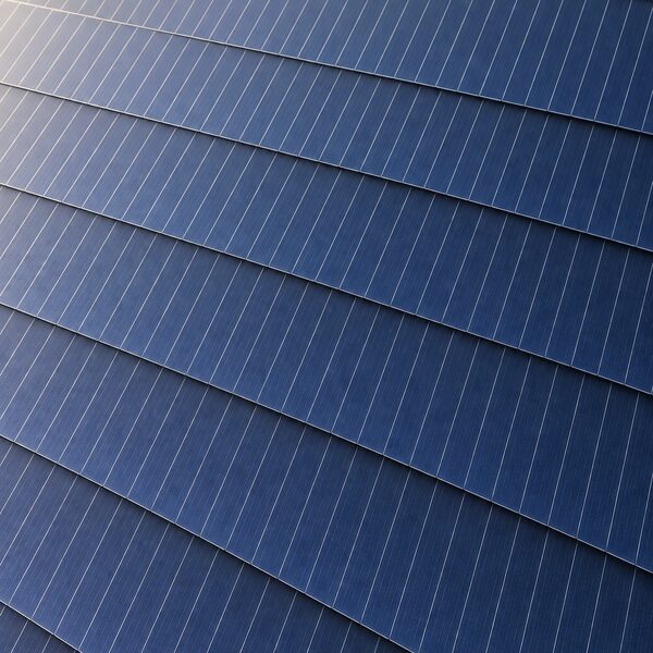 A close-up view of a solar panel surface showing narrow one-third cut TOPCon cells overlapped in a shingled layout with no gaps or ribbon strips between them, filling the frame edge to edge.
