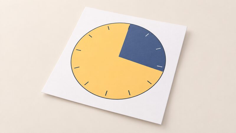 A printed 24-hour clock diagram shown as a physical sheet, with a 7-hour dark cheap overnight band and a 17-hour lighter dearer day band, no numbers or words.