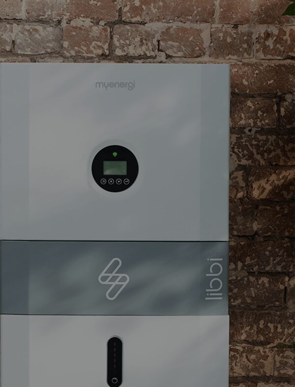 A grey myenergi libbi home battery unit mounted on a brick wall