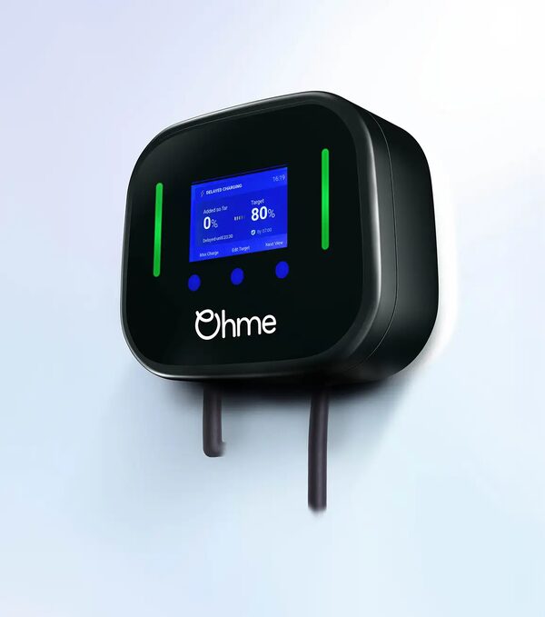 A black Ohme Home Pro wall-mounted EV charger with a blue display screen and green indicator lights