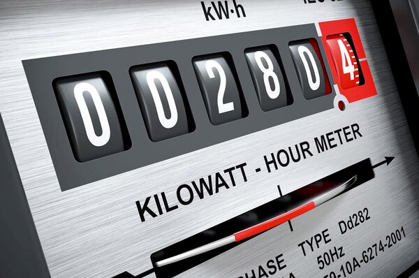 A close-up of a mechanical kilowatt-hour electricity meter with rolling digit dials reading 002804